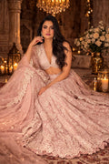 Elegant blush pink bridal lehenga set by Kathaa, embroidered with intricate designs, featuring a luxurious traditional Indian style.