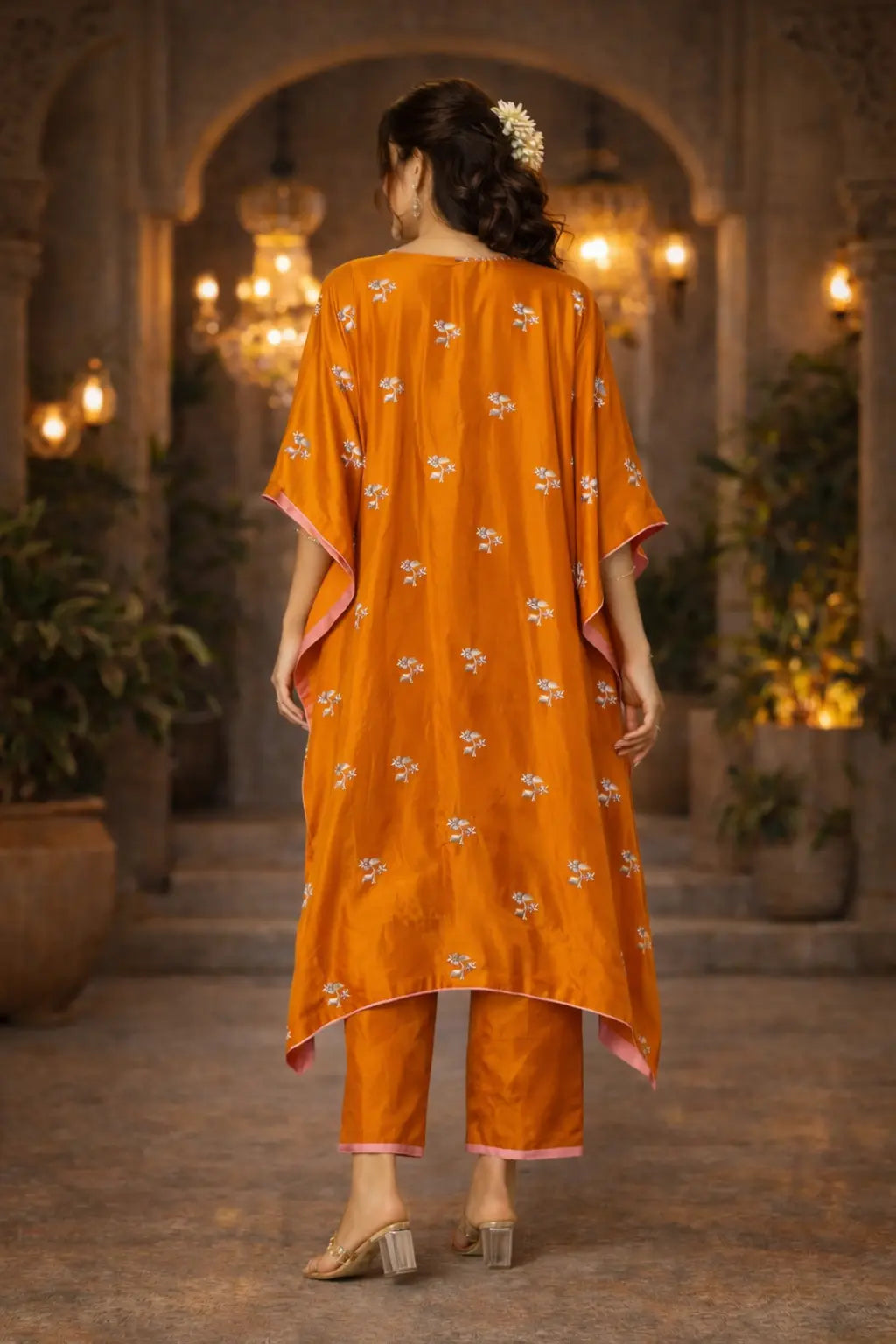 Back view of Kathaa Luxury Orange Zahira Kaftan Set with silk kaftan and cotton silk pants on a model.