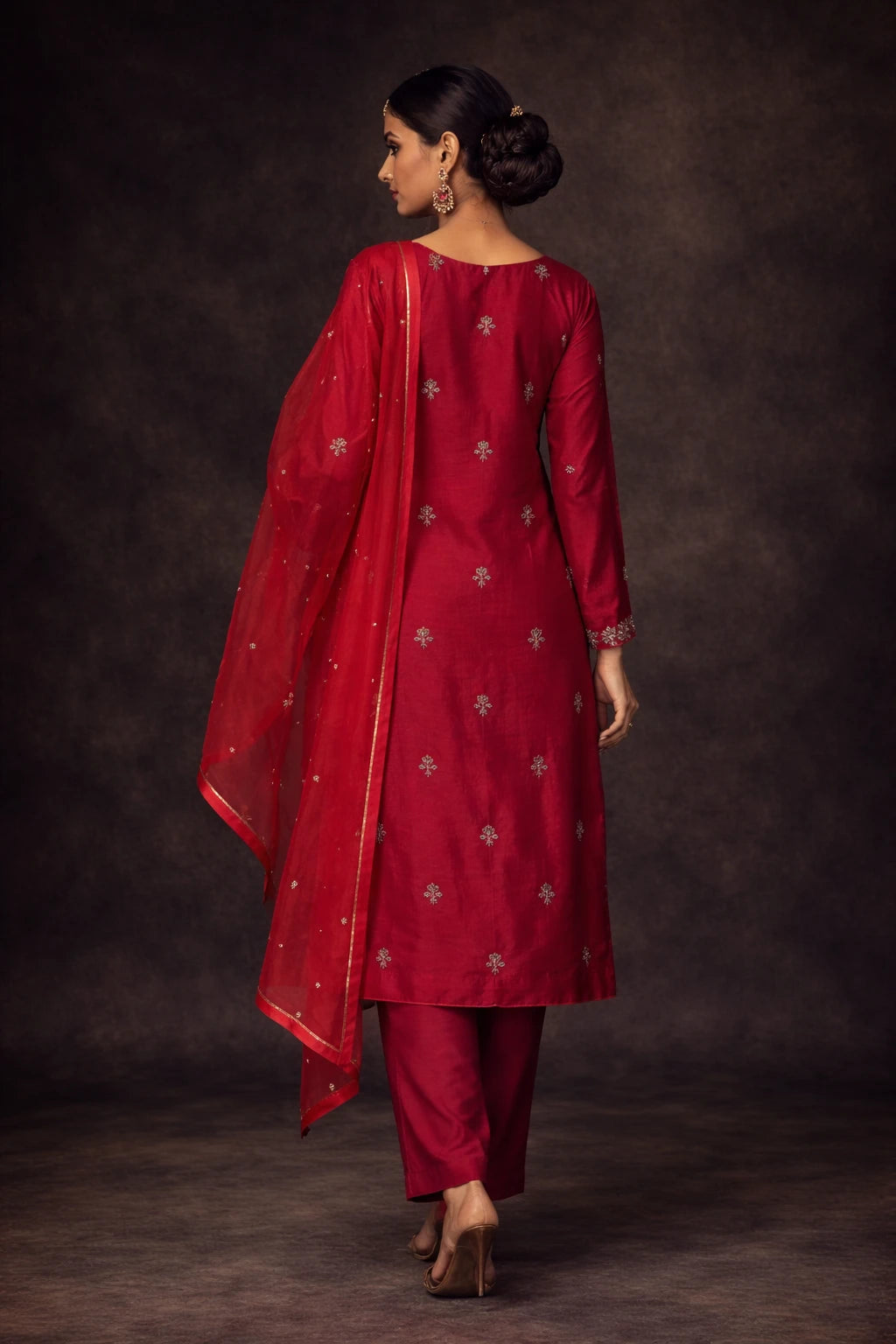 Back view of Kathaa Lalima red designer kurta set with matching dupatta, showcasing intricate embroidery and traditional festive style.