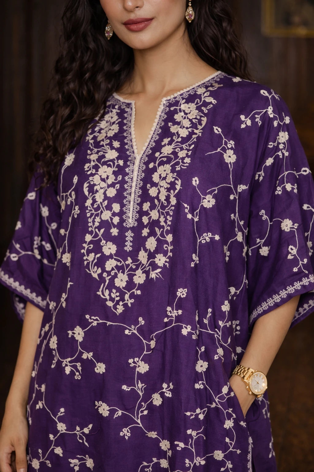 Closeup of Kathaa's purple dupioni silk Zareen Kaftan set with detailed embroidery and matching cotton silk pants.