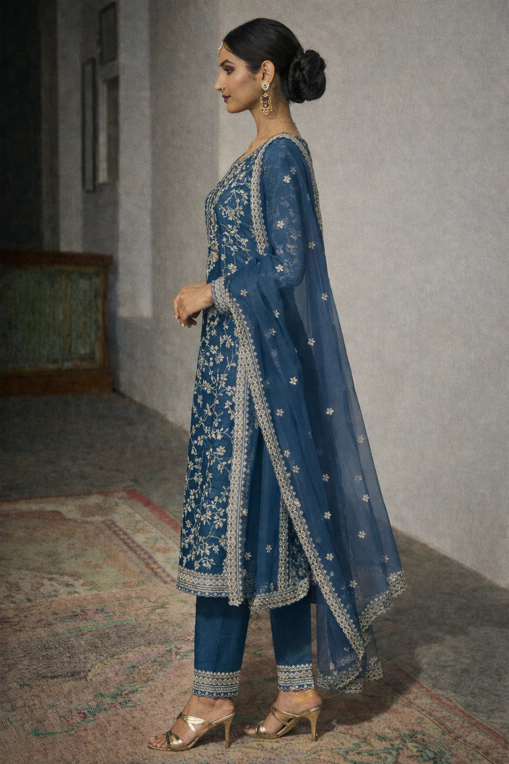 Side view of Kathaa Neelanshi Kurta Set, a designer blue festive kurta with matching dupatta, showcasing intricate embroidery and elegant fabric.